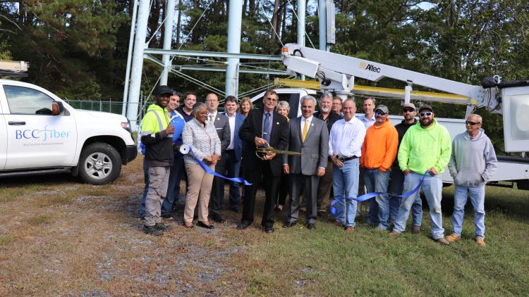  Worcester County Commissioners joined Bay Country Communications (BCC) officials at the foot of the Newark water tower on October 19, 2022 to cut the ribbon on a new fiber-optic installation project to make broadband available in the Newark area. 